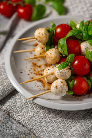 Simple and beautiful food with basil, mozzarella and balsamic vinegarの写真素材