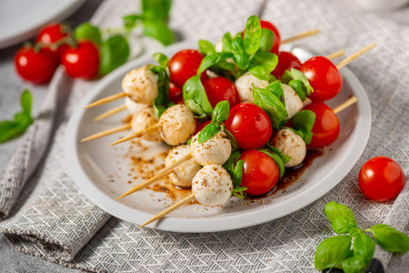 Simple and beautiful food with basil, mozzarella and balsamic vinegarの写真素材