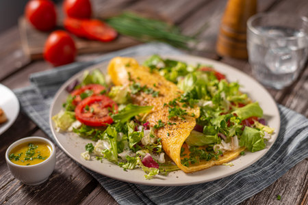 Delicious eggs omelette with salad and vegetablesの写真素材
