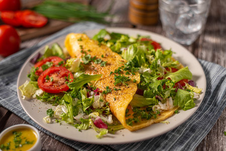 Delicious eggs omelette with salad and vegetablesの写真素材