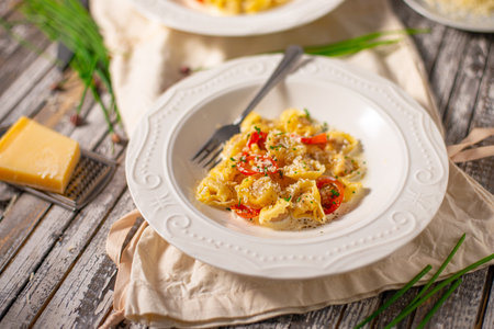 Delicious pasta stuffed with meat and cream sauce with garlic and herbsの写真素材