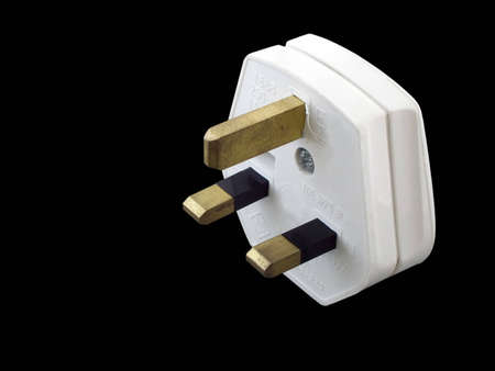 British electrical plug isolated on blackの写真素材