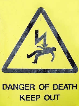 A sign warning of electrical dangerの写真素材