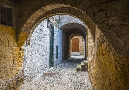 Medieval arches along a cobbled street in the old town of Rhodes, greece.の写真素材