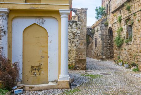 Typical street in the old town of Rhodes in Greece showing medieval type streets and architectureの写真素材