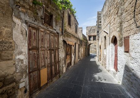 Typical street in the old town of Rhodes in Greece showing medieval type streets and architectureの写真素材