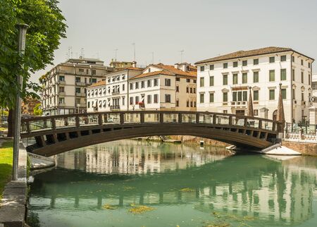 Typical venetian architecture along the streets of the Italian town of Treviso in the Northern region of Veneto.の写真素材