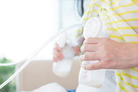 Automatic breast pump by mother.の写真素材