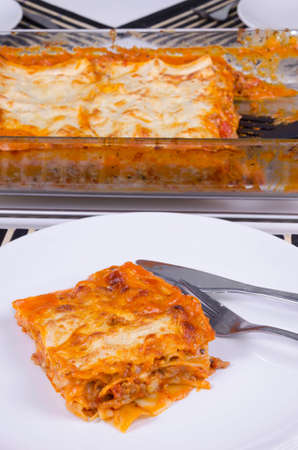 Closeup for portion of home made lasagnaの写真素材
