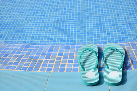 Women s flip flops near tropical poolの写真素材