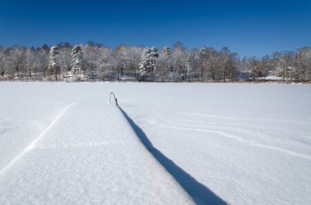 Lake bridge in winter seasonの写真素材