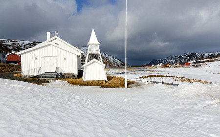 Church in the front of Skarsvag villageの写真素材