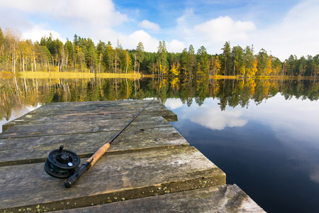Autumn fly fishing in the lakeの写真素材