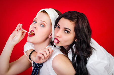 Young girls with lollipopの写真素材