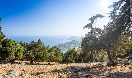 Sunny panorama from first level of Tsambika mountainの写真素材