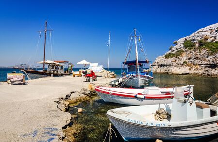 Fishing boats moored in the Kolymbia harbor, in September 06,2015 on Rhodesのeditorial素材