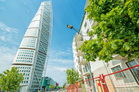 MALMO, SWEDEN - MAY 29, 2016: Turning Torso facade on May 29, Sweden. Turning Torso is a deconstructivist skyscraper designed by the Spanish architect Santiago Calatrava - street side view.のeditorial素材