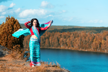 Arabic girl in Swedish lake scenery