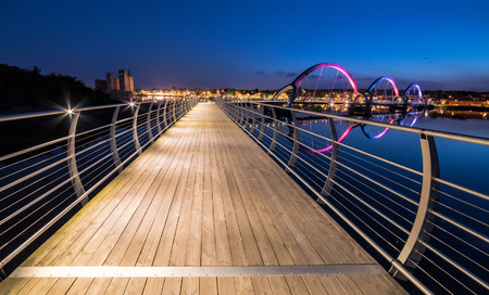 Night view for long pedestrian bridge in Solvesborg at summer time