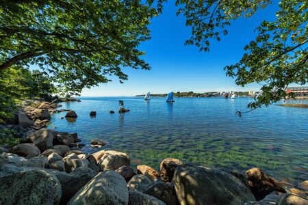 Beautiful natural sea frame with sailboatsの写真素材