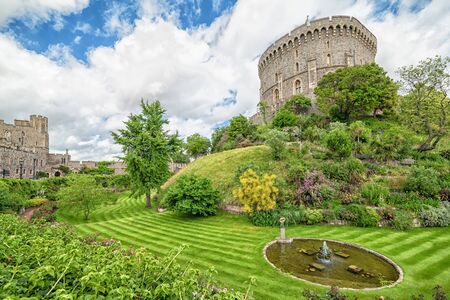 WINDSOR, ENGLAND - JULY 10, 2016: Summer view for gardens and towers in Medieval Windsor Castle. Windsor Castle is a royal residence at Windsor in the English county of Berkshire, built in 1066 yearのeditorial素材