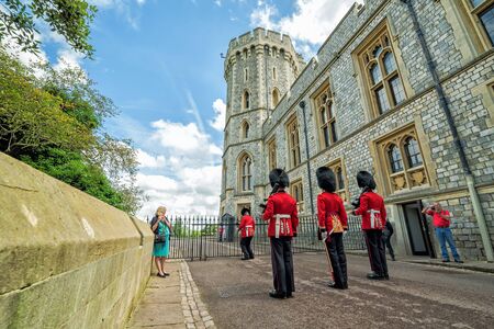 WINDSOR - UK - JULY 10, 2016: Unidentified men members of the royal guard during change ceremony in July 10, 2016 in Windsor, United Kingdom.のeditorial素材