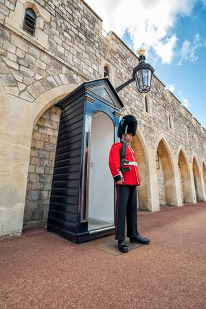 WINDSOR - UK - JULY 10, 2016: Unidentified man member of the royal guard on duty at Windsor Castle, in July 10, 2016 in Windsor, United Kingdom.のeditorial素材