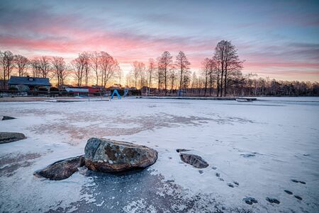 Beautiful winter daybreak over Swedish lakeの写真素材