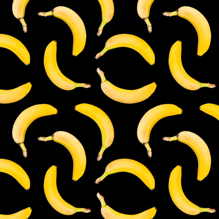 Bananas, photographic seamless pattern. Photo of bananas. Isolated on black background. Seamless pattern. Seamless pattern of bananas on black background. Seamless photographic bananas pattern.の写真素材