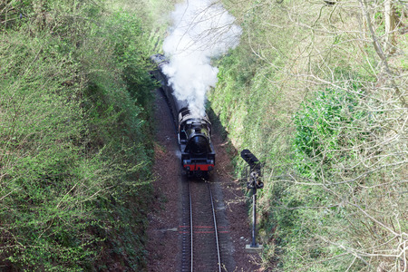 Steam train heading for Alton on the Mid Hants Railwayのeditorial素材