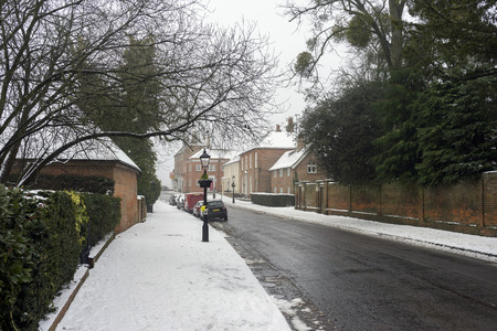 Snowy winter street scene at Odiham in Hampshire, UKの写真素材