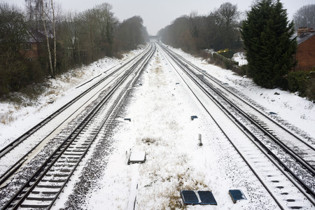 Snowy scene at Hook in Hampshire, UK on the South Western Mainlineの写真素材