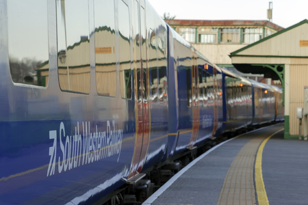 Alton, UK. 13th March 2018. Class 450 Desiro in SWT livery but partially re-branded in South Western Railway logos in Alton station at the end of the Alton Branch Line which serves London Waterloo.のeditorial素材