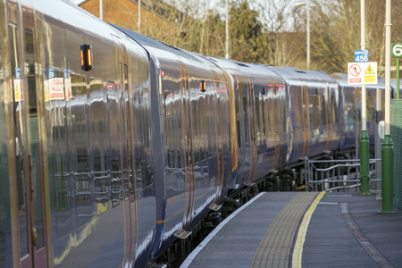 Alton, UK. 13th March 2018. Class 450 Desiro in SWT livery but partially re-branded in South Western Railway logos in Alton station at the end of the Alton Branch Line which serves London Waterloo.のeditorial素材