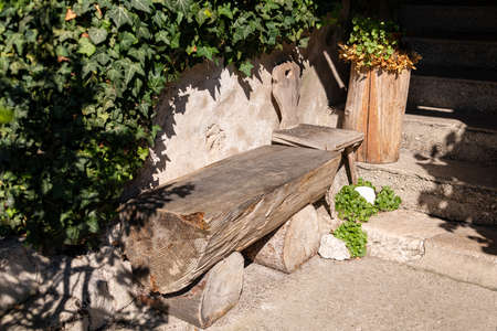 Take a rest on a crafted wooden benchの写真素材