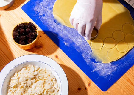 Cutting Marzipan Dough Into Circles For Delicious Christmas Cookiesの写真素材