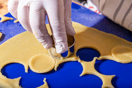 Handmade Christmas Cookies - Cutting Marzipan Dough Into Circlesの写真素材