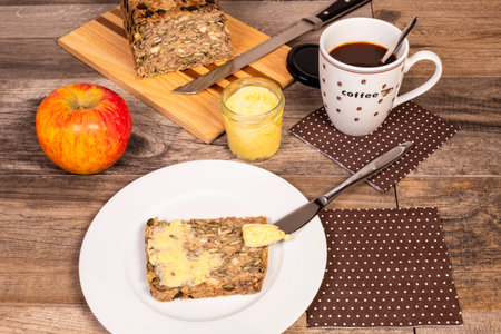 Preparing Healthy Breakfast With Whole-Grain Bread, Saffron Butter and Appleの写真素材