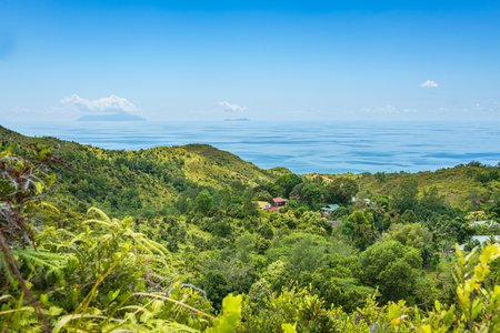 View Over An Idyllic Settlement On Praslin Island To Silhouette And North Islandの写真素材