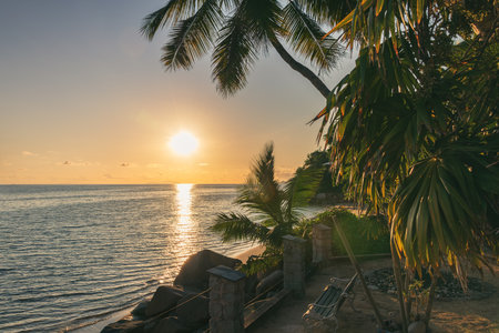 A Bench At The Beach To Enjoy The Beautiful Sunset At Praslin Island, Seychellesの写真素材