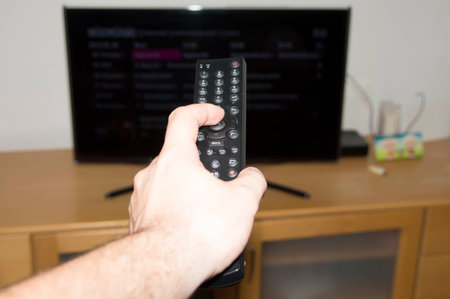 Watching TV and using remote controller