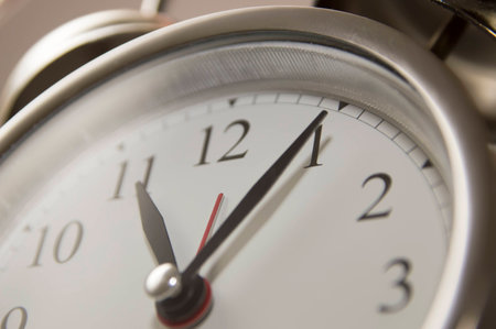 Closeup of hands on clock face