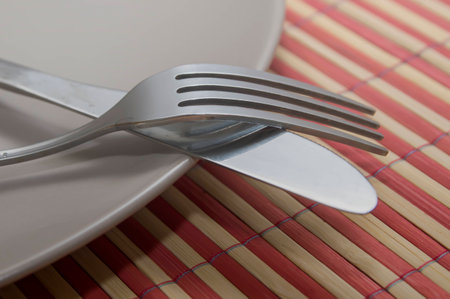 White plate, fork and knife