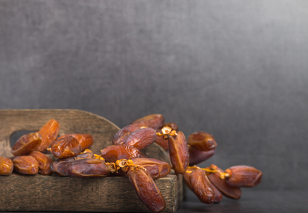 fresh harvested dates on a grey background