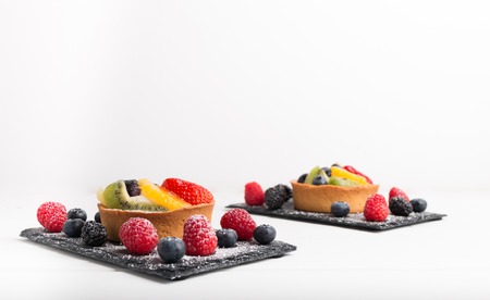 freshly homemade fruit cake on a table isolated on a white background.の写真素材