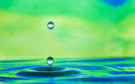 blue water droplets with a green backgroundの写真素材