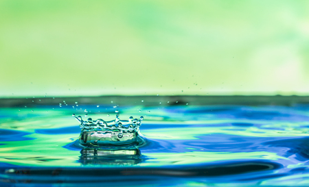 blue water droplets with a green backgroundの写真素材