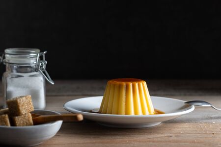 Homemade desert creme caramel pudding with a cup of coffee
