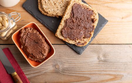 Vegan chocolate spread made of organic almond butter and organic cacao and honey