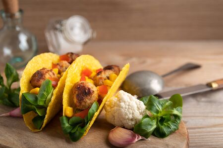Homemade delicious taco with vegan meatballs and vegetables.の写真素材